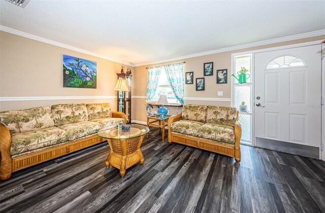 living room with ornamental molding, plenty of natural light, and dark hardwood / wood-style floors