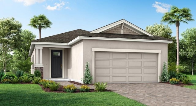 view of front of home with a front lawn and a garage