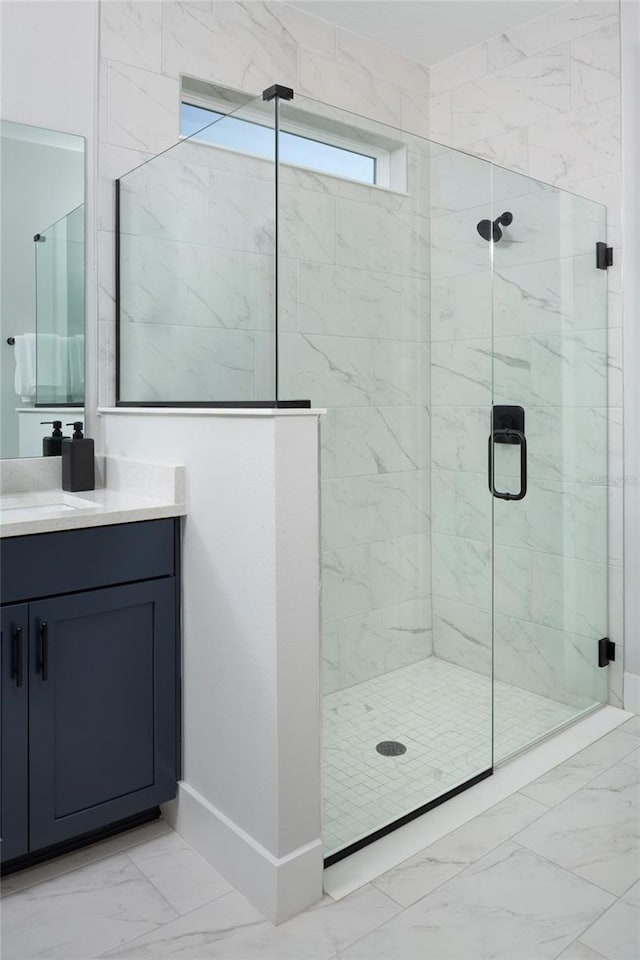 bathroom with an enclosed shower and vanity