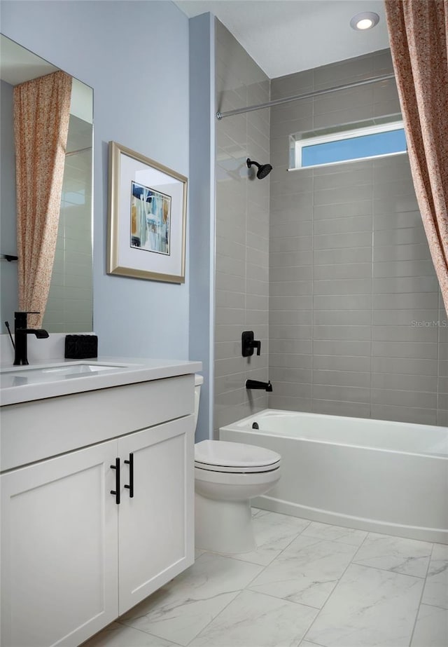 full bathroom with shower / bathtub combination with curtain, vanity, and toilet