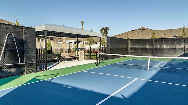 view of tennis court featuring basketball court