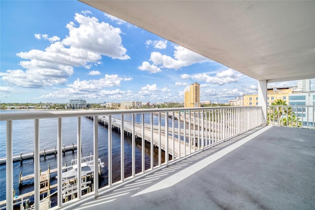 balcony featuring a water view