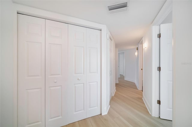 corridor featuring light hardwood / wood-style flooring