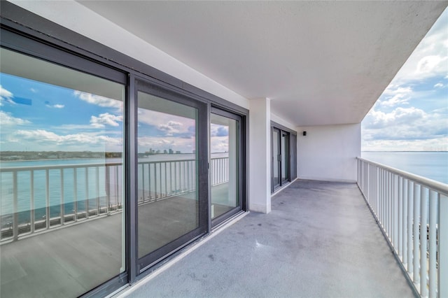 balcony featuring a water view