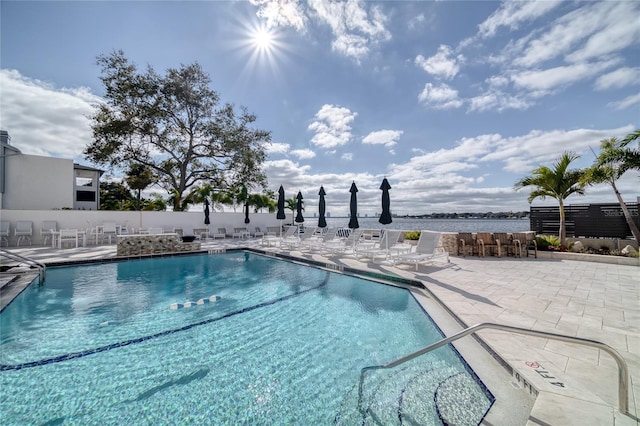 view of swimming pool with a patio