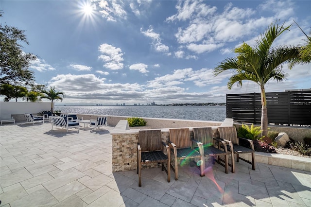 view of patio featuring a water view