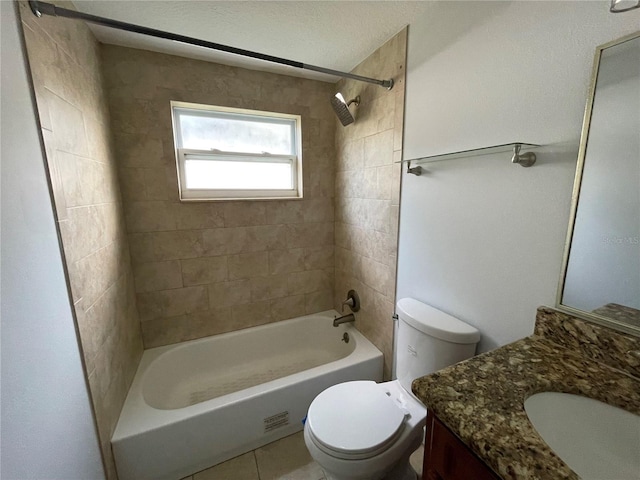 full bathroom with vanity, tile patterned flooring, toilet, and tiled shower / bath