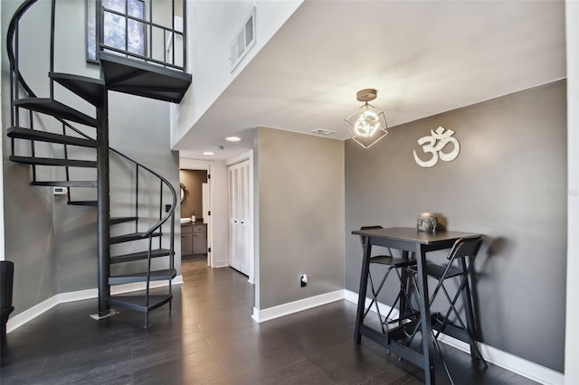 dining area with dark wood-type flooring