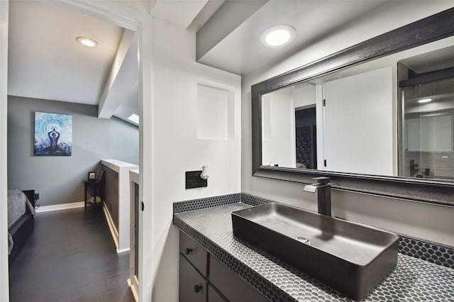 bathroom featuring hardwood / wood-style flooring and vanity