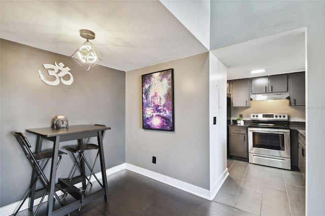 kitchen with hardwood / wood-style floors and stainless steel electric range