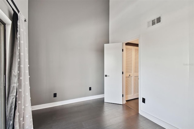 empty room featuring dark hardwood / wood-style floors