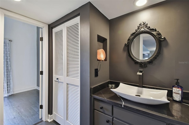 bathroom featuring hardwood / wood-style floors and vanity