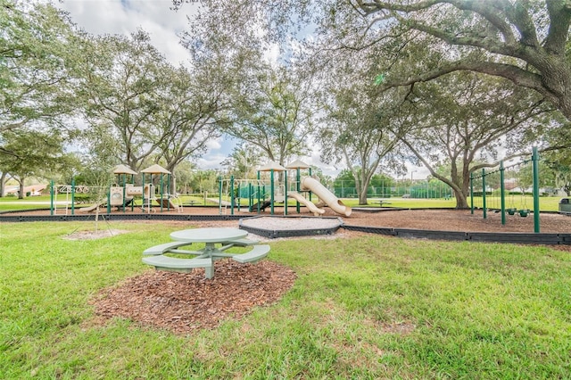 view of playground featuring a lawn