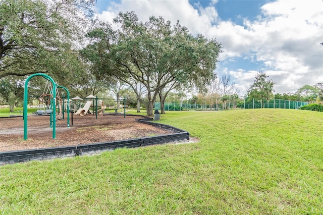 view of jungle gym with a lawn