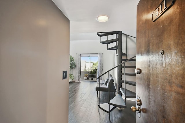 stairs with wood-type flooring