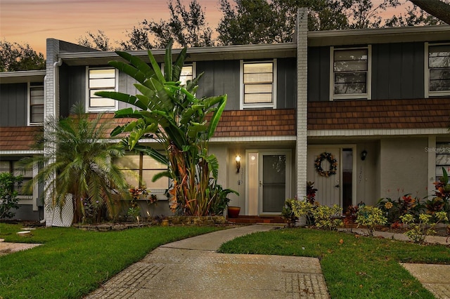 view of front of house with a yard