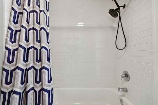 bathroom featuring shower / bathtub combination with curtain