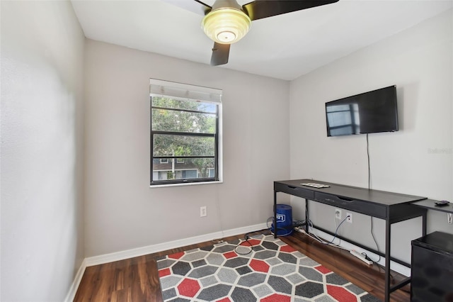 interior space with dark wood-type flooring and ceiling fan