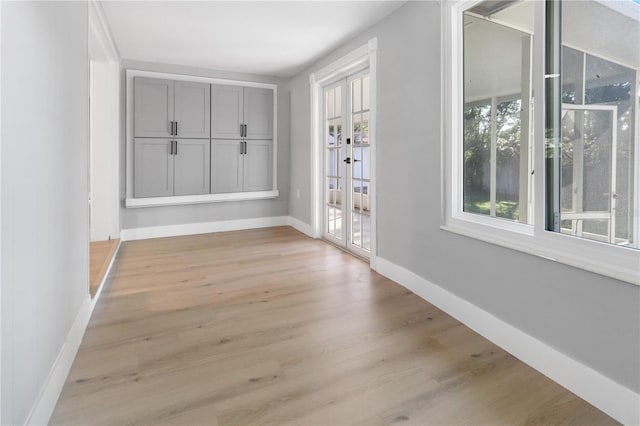 interior space featuring light hardwood / wood-style flooring and french doors