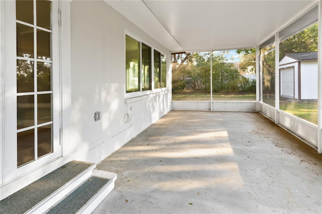 unfurnished sunroom featuring plenty of natural light