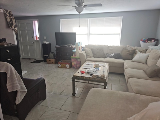 tiled living room featuring ceiling fan