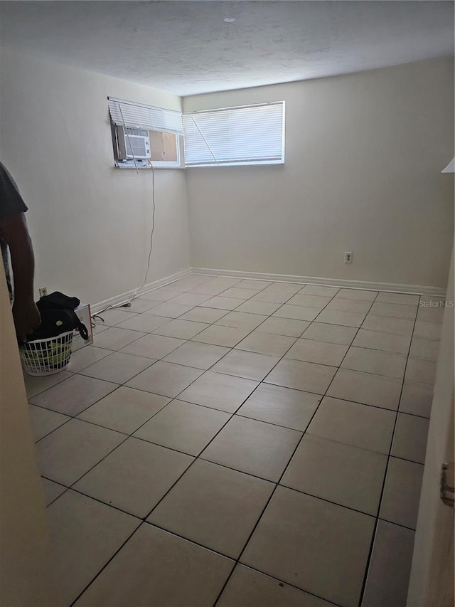 basement featuring light tile patterned floors