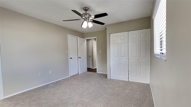 unfurnished bedroom featuring a ceiling fan, baseboards, carpet floors, and a closet