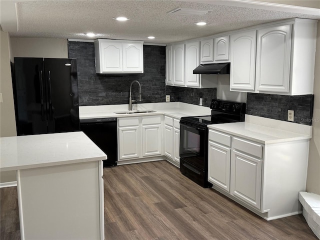 kitchen with white cabinetry, dark wood-type flooring, sink, and black appliances