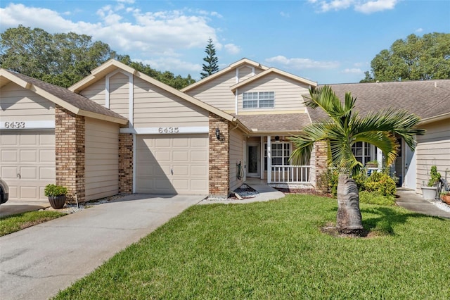 view of front of property with a front yard and a garage