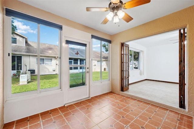 doorway to outside featuring ceiling fan