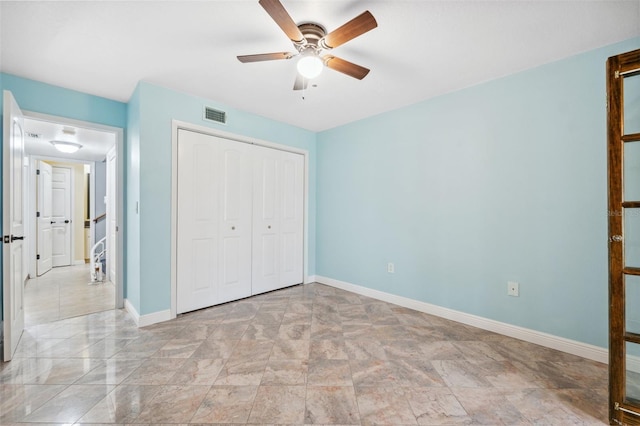 unfurnished bedroom with a closet and ceiling fan