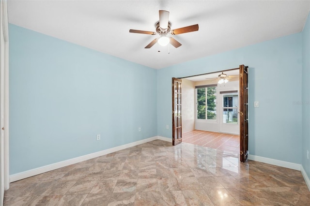 spare room with ceiling fan