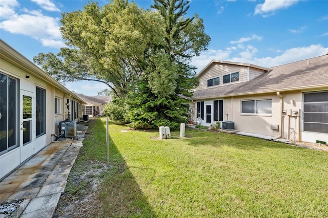 view of yard with central AC