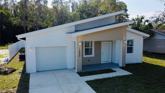 view of front of house with a garage and a front yard