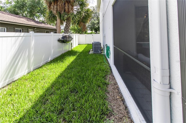 view of yard with central AC