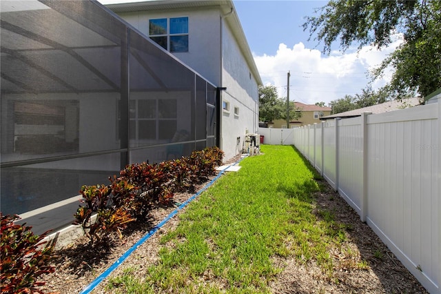 view of yard featuring a lanai