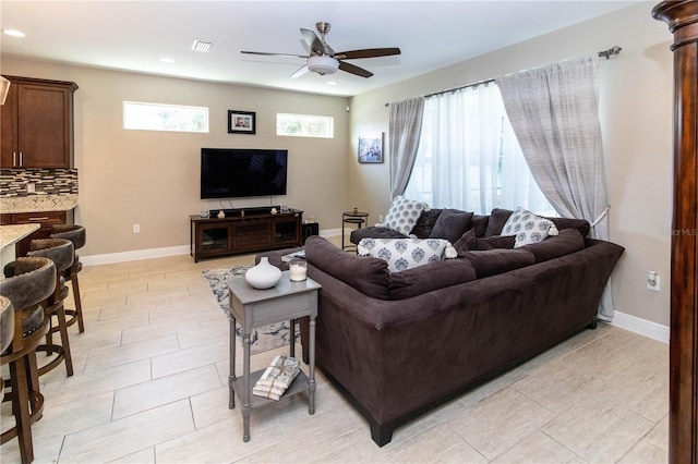 living room featuring ceiling fan