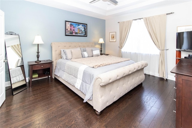 bedroom with dark wood-type flooring and ceiling fan