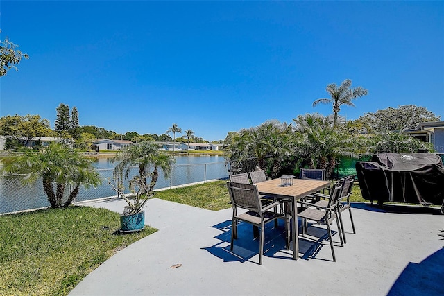 view of patio / terrace featuring a water view and a grill