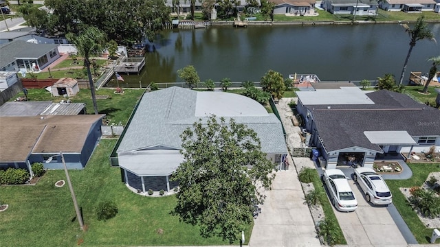 birds eye view of property featuring a water view