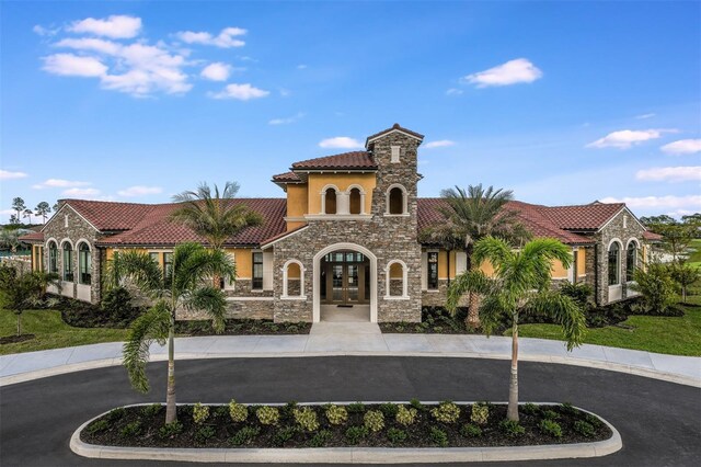 view of property featuring curved driveway