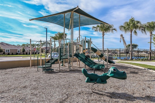 communal playground featuring fence