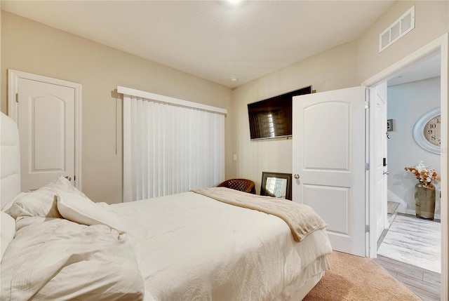 bedroom with light hardwood / wood-style floors