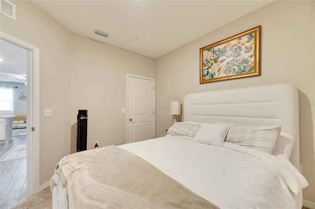 bedroom with light wood-type flooring