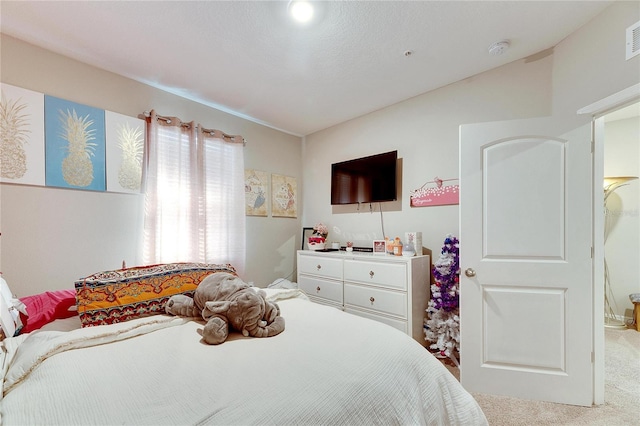 bedroom with carpet and vaulted ceiling