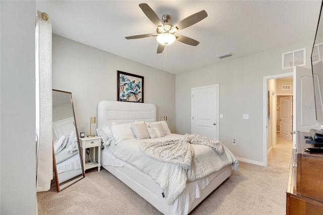 bedroom with light carpet and ceiling fan