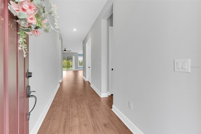 corridor featuring light hardwood / wood-style floors