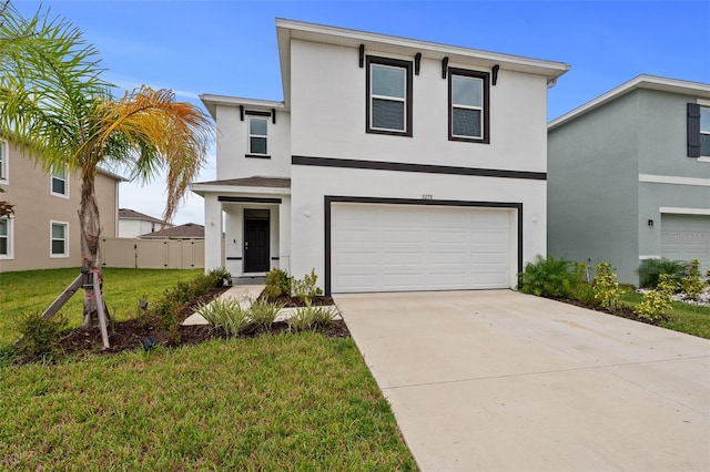 view of front of property with a front yard and a garage