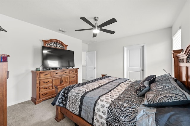 bedroom featuring light carpet and ceiling fan