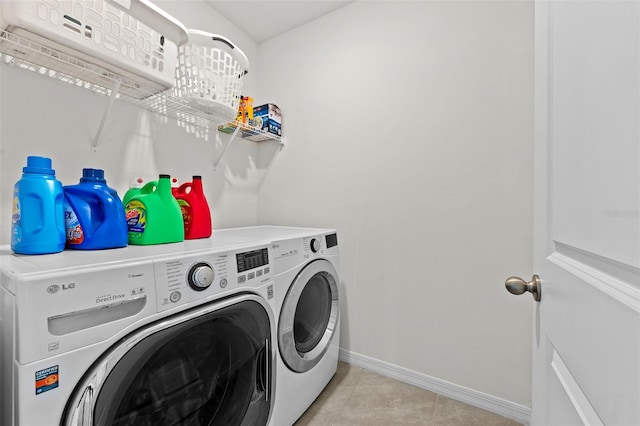 laundry room with washing machine and dryer